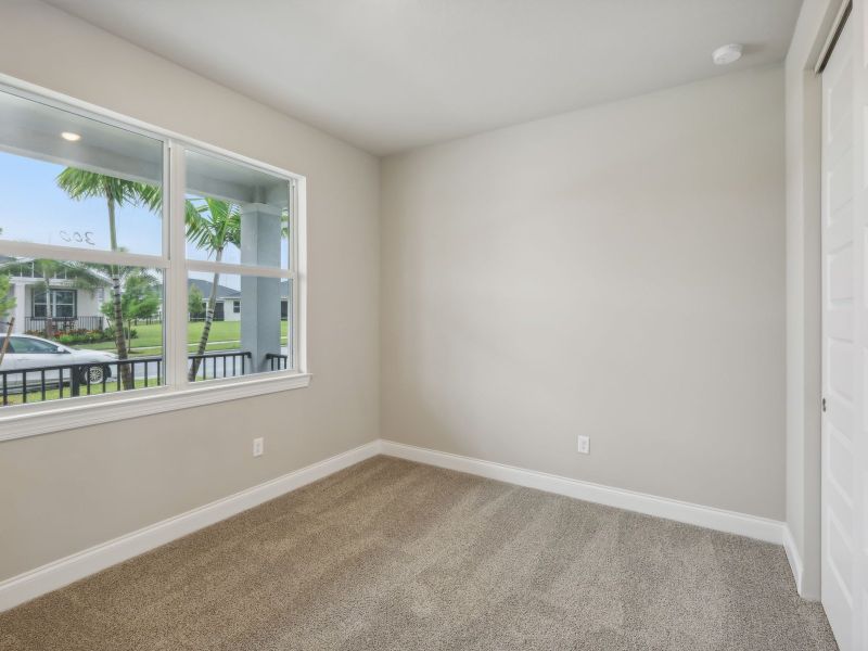 Bedroom in the Coral floorplan at 6398 NW Sweetwood Dr