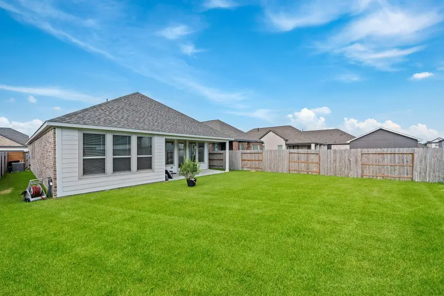 Front exterior of a new home in Marvida 45', Cypress, TX, highlighting curb appeal (Image 1). Front exterior of a new home in Marvida 45', Cypress, TX, highlighting curb appeal (Image 1).