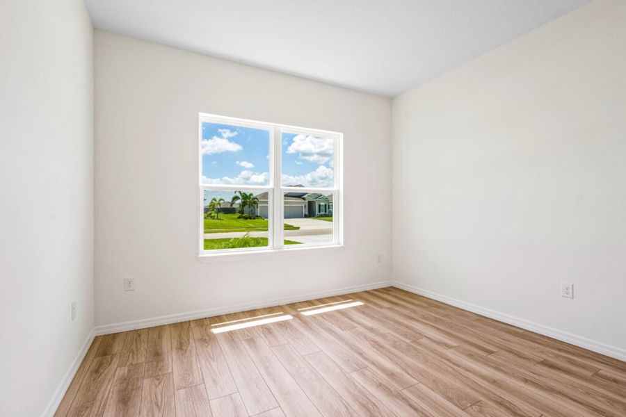 Representative unfurnished interior of a home built from the Jensen by Holiday Builders in Pineapple Grove, Port St. Lucie (Image 7).