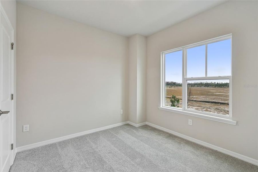 Spacious, unfurnished interior of a new home in Laureate Park at Lake Nona - Garden Series, Orlando (Image 29).