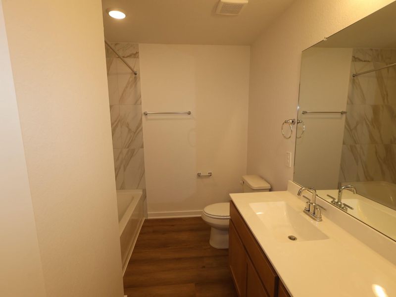 Furnished interior view inside a new home in Pinewood at Grand Texas, New Caney (Image 9).