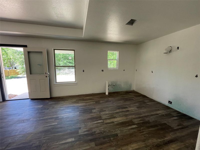 Kitchen view coming in through the garage.