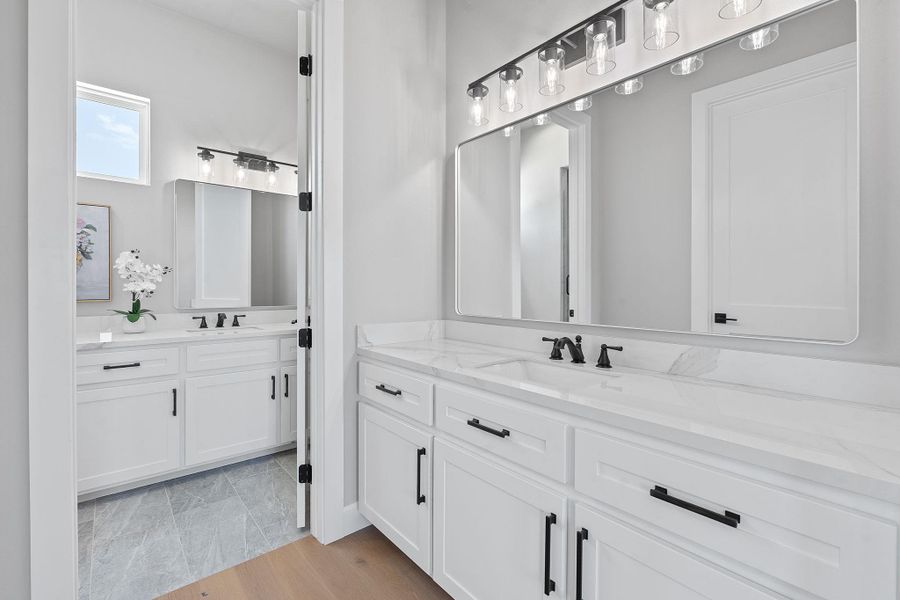Bathroom featuring two vanities