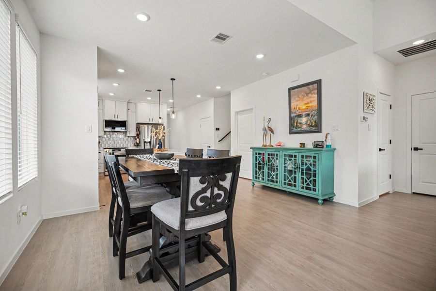 Dining area positioned within the open-concept layout, providing a seamless flow between the kitchen and main living spaces. Dining area positioned within the open-concept layout, providing a seamless flow between the kitchen and main living spaces.
