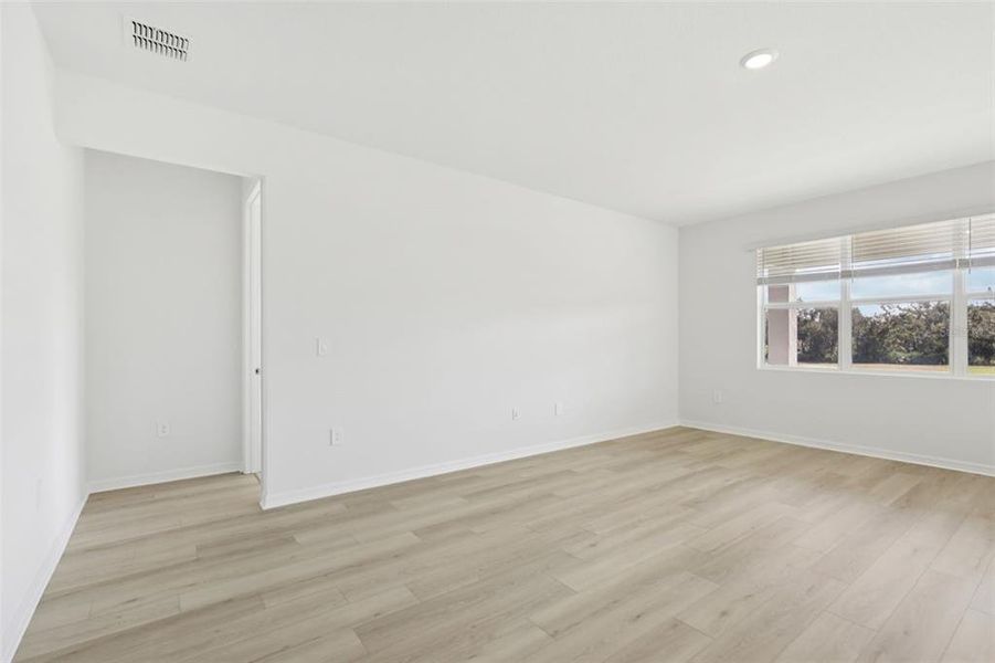 Spacious, unfurnished interior of a new home in Coasterra - Reserve Series, Palmetto (Image 31).