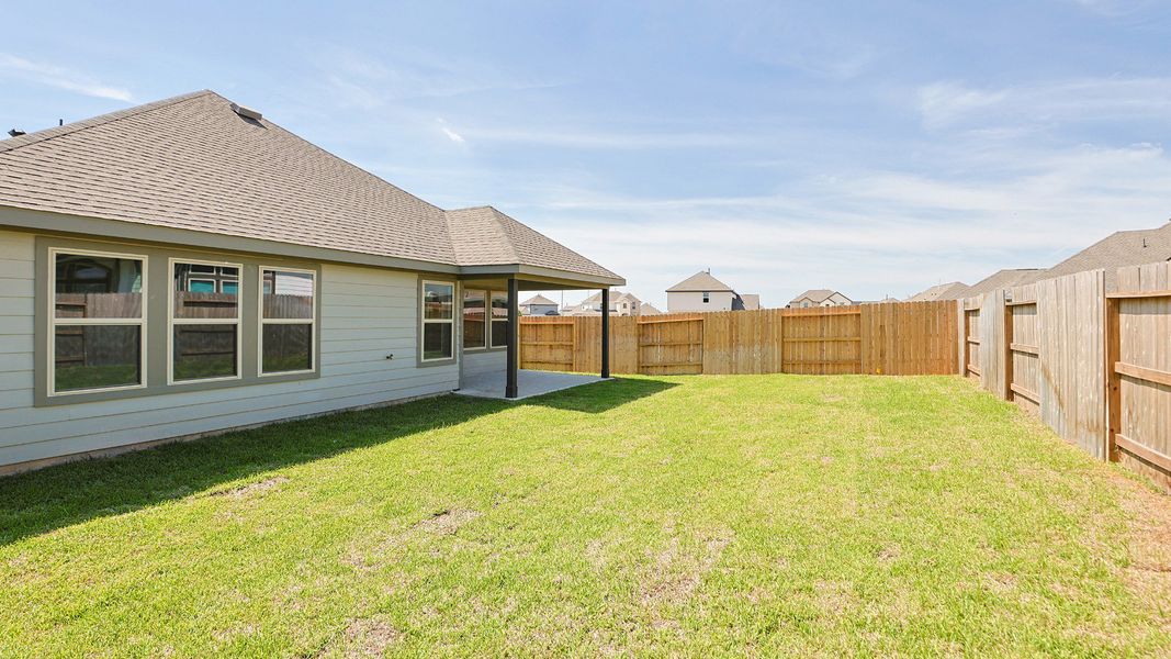 Exterior details and patio area of a home in Sunterra, Katy (Image 20).