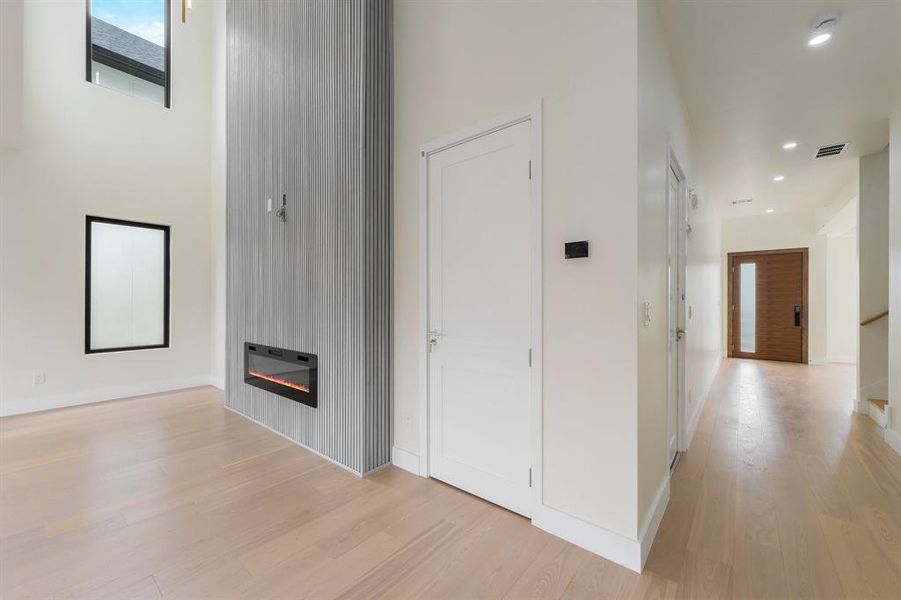 Family room & Hallway featuring light wood-style floors and recessed lighting