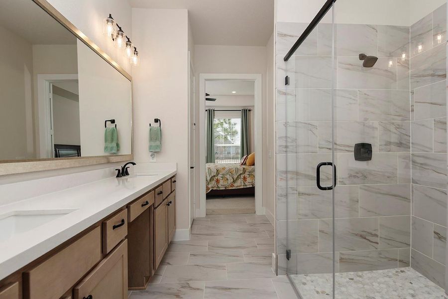 Large framed mirror in primary bath; double vanities Large framed mirror in primary bath; double vanities