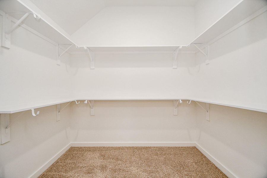 View of the ample closet space of the secondary bedroom. View of the ample closet space of the secondary bedroom.