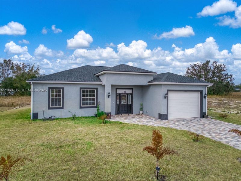 Front exterior of a new home in , Avon Park, FL, highlighting curb appeal (Image 28).