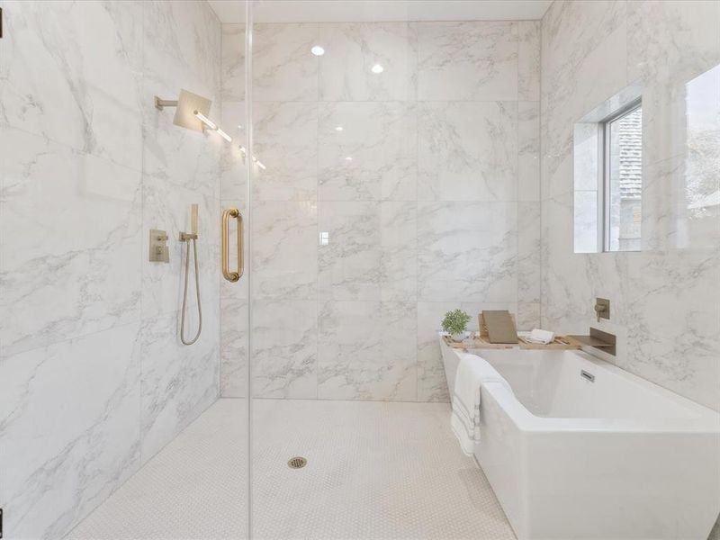 Full bath with a soaking tub and a marble finish shower