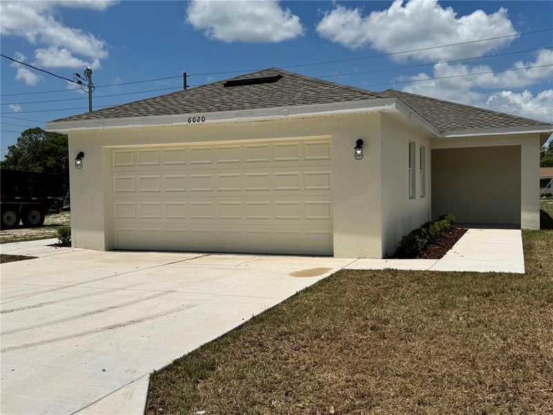 Front exterior of a new home in , Zephyrhills, FL, highlighting curb appeal (Image 23). Front exterior of a new home in , Zephyrhills, FL, highlighting curb appeal (Image 23).