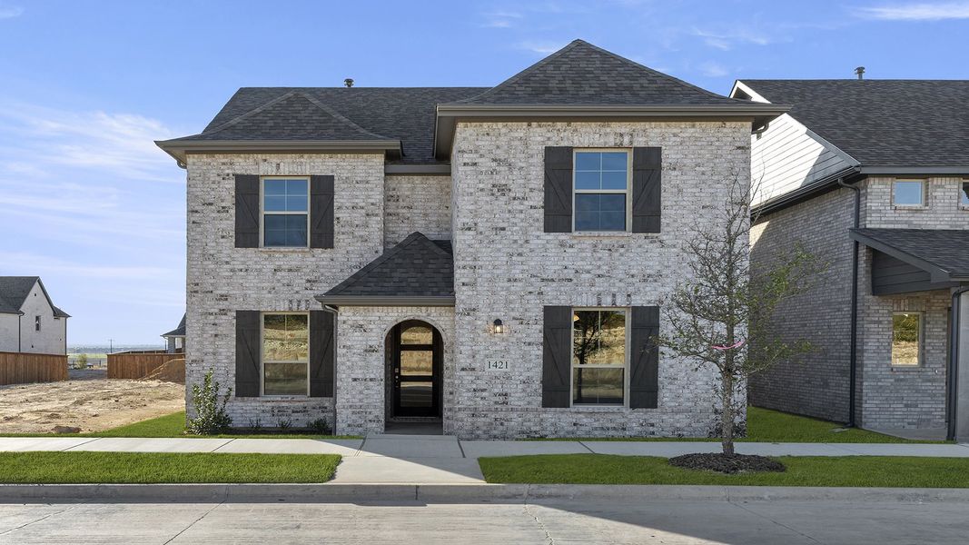 Front exterior of a new home in Hillside Village 40s, Celina, TX, highlighting curb appeal (Image 2). Front exterior of a new home in Hillside Village 40s, Celina, TX, highlighting curb appeal (Image 2).