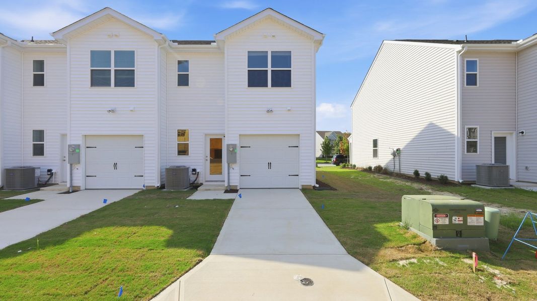 Front exterior of a new home in Clock Road Townhomes, New Bern, NC, highlighting curb appeal (Image 22). Front exterior of a new home in Clock Road Townhomes, New Bern, NC, highlighting curb appeal (Image 22).