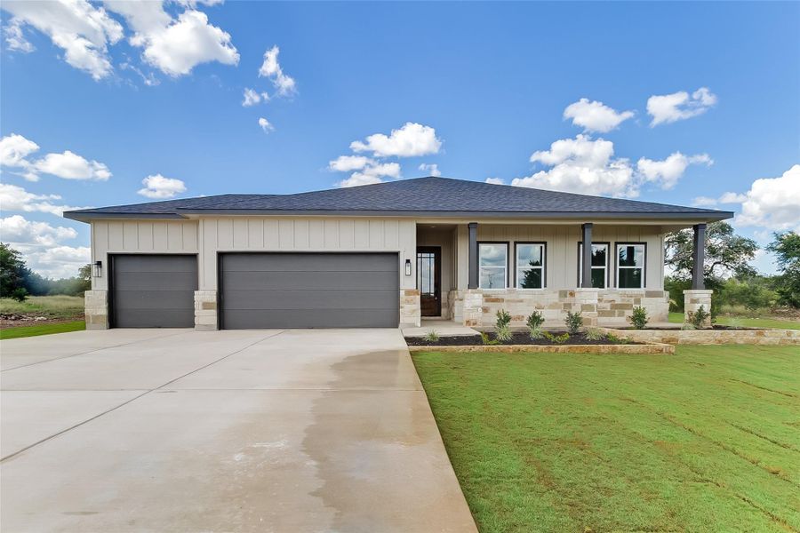 Front exterior of a new home in , Bertram, TX, highlighting curb appeal (Image 21).