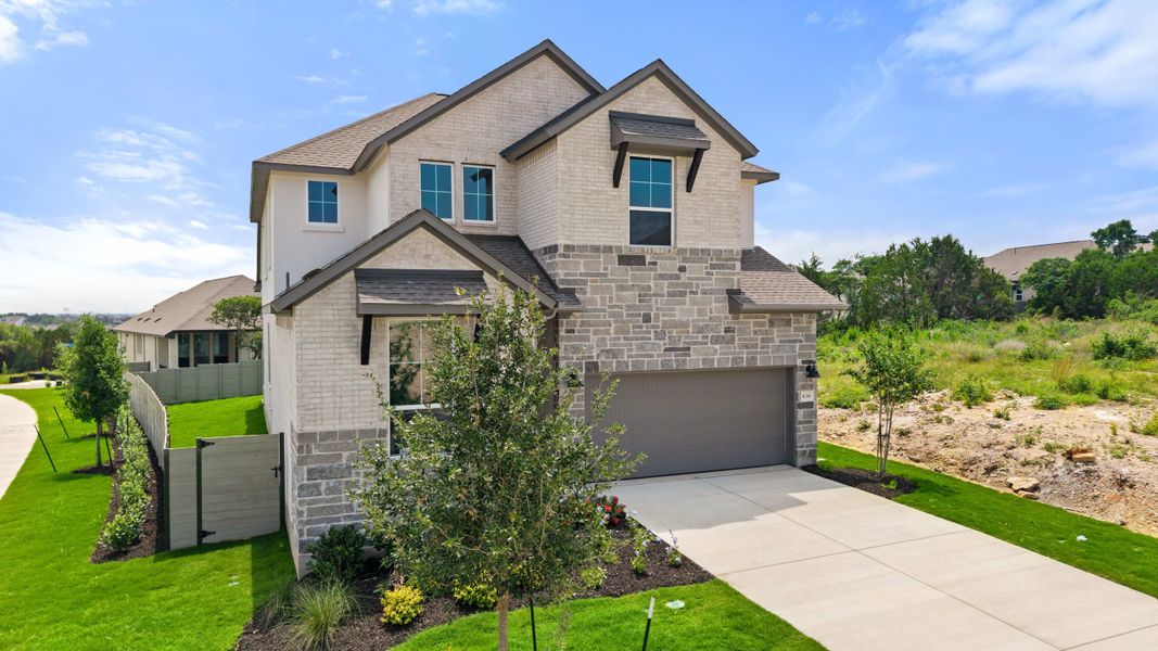 Front exterior of a new home in Wolf Ranch, Georgetown, TX, highlighting curb appeal (Image 26).