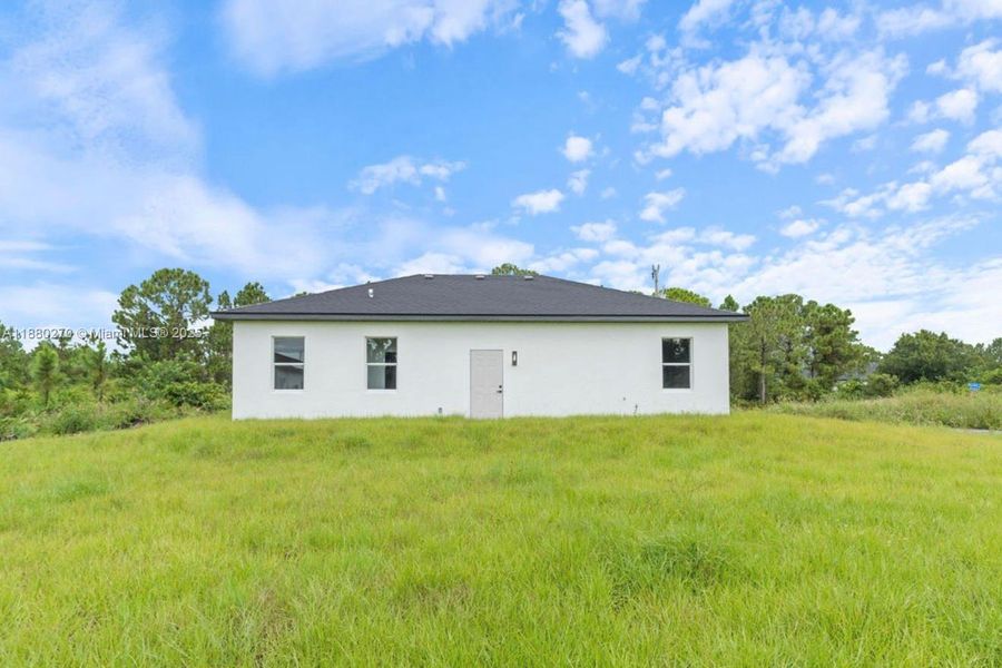 Front exterior of a new home in , Lehigh Acres, FL, highlighting curb appeal (Image 2). Front exterior of a new home in , Lehigh Acres, FL, highlighting curb appeal (Image 2).