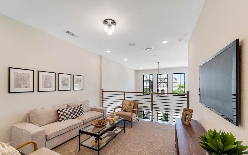 Representative furnished interior of a home built from the Rainier by CastleRock Communities in The Summit at Center Stage, Keller (Image 18).