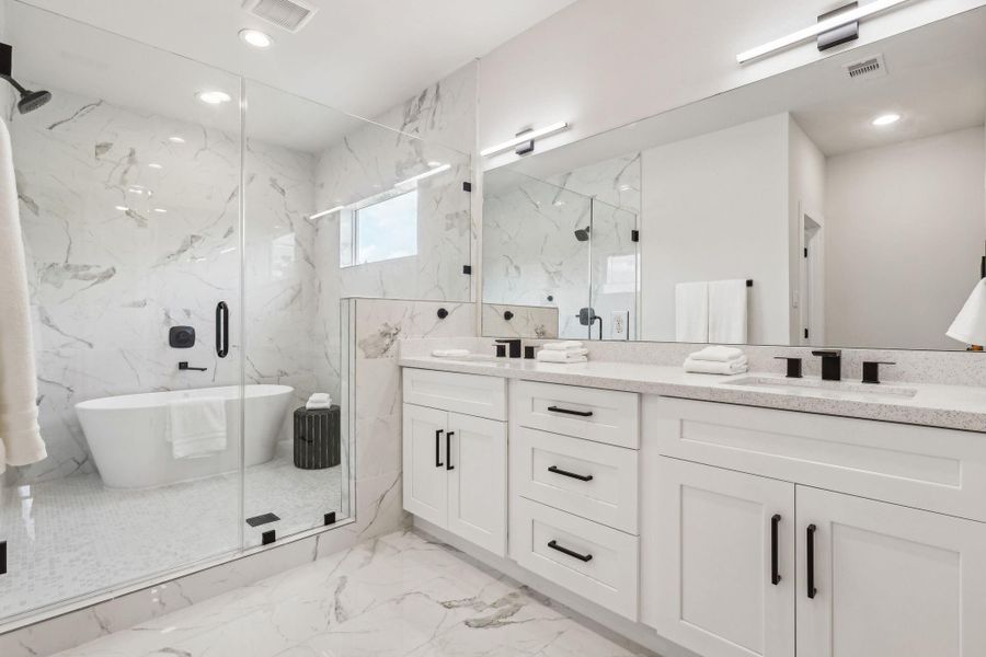 Master bathroom with double sinks and soaking tub