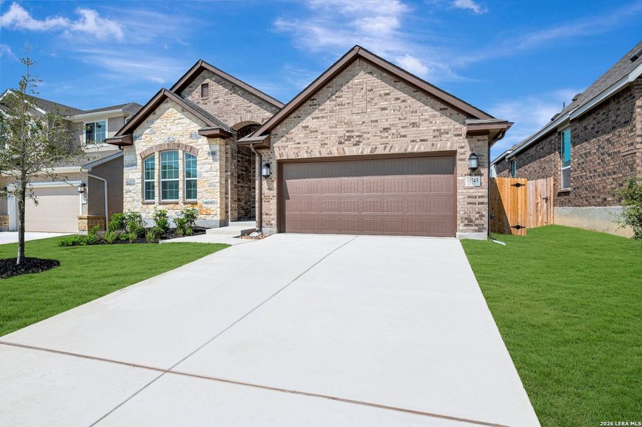 Front exterior of a new home in Davis Ranch 50', San Antonio, TX, highlighting curb appeal (Image 23).