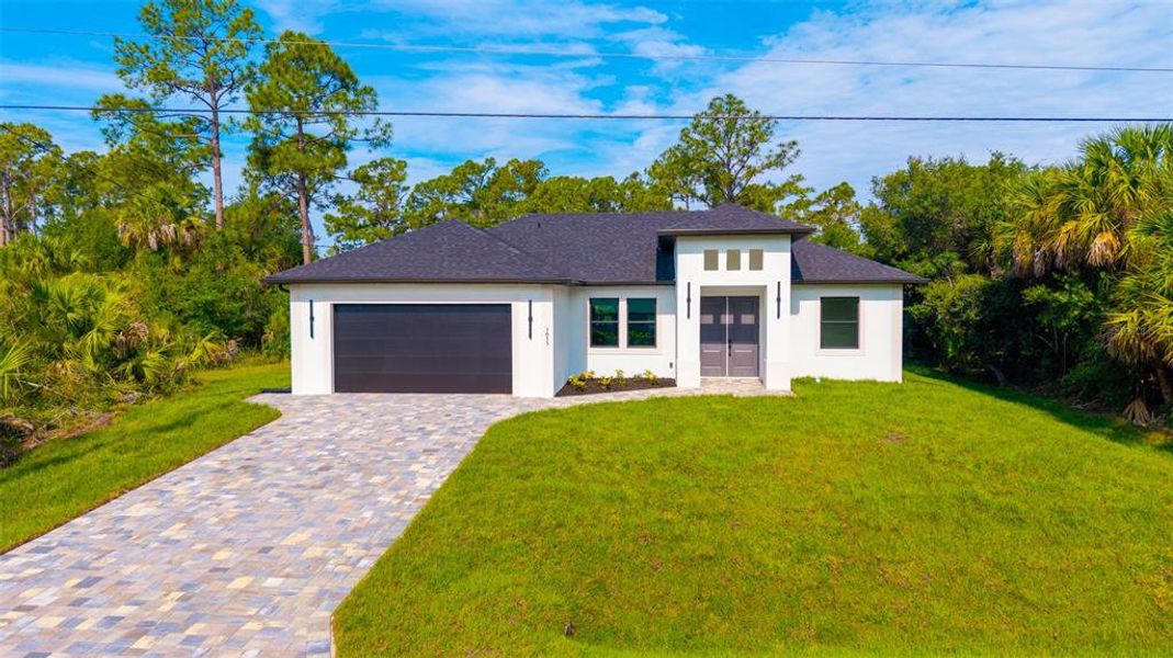Front exterior of a new home in , North Port, FL, highlighting curb appeal (Image 31). Front exterior of a new home in , North Port, FL, highlighting curb appeal (Image 31).