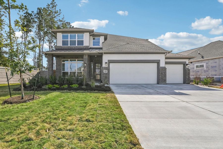 Front exterior of a new home in Artavia, Conroe, TX, highlighting curb appeal (Image 1). Front exterior of a new home in Artavia, Conroe, TX, highlighting curb appeal (Image 1).
