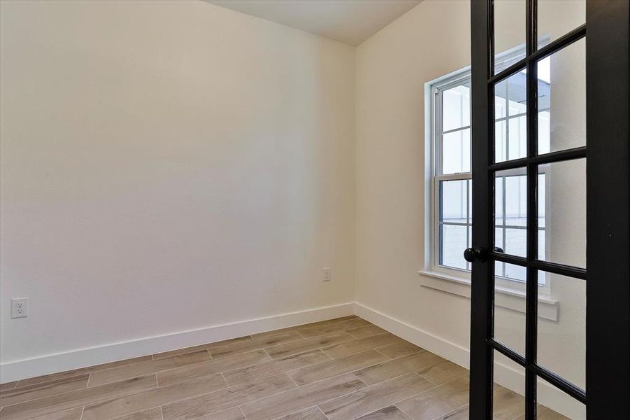 Empty room featuring light wood-type flooring