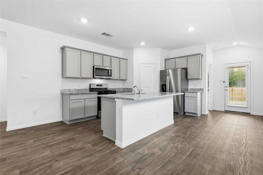 The kitchen is ready to use with desirable contemporary finishes and an island with bar seating perfect for causal meals and conversations. The kitchen is ready to use with desirable contemporary finishes and an island with bar seating perfect for causal meals and conversations.