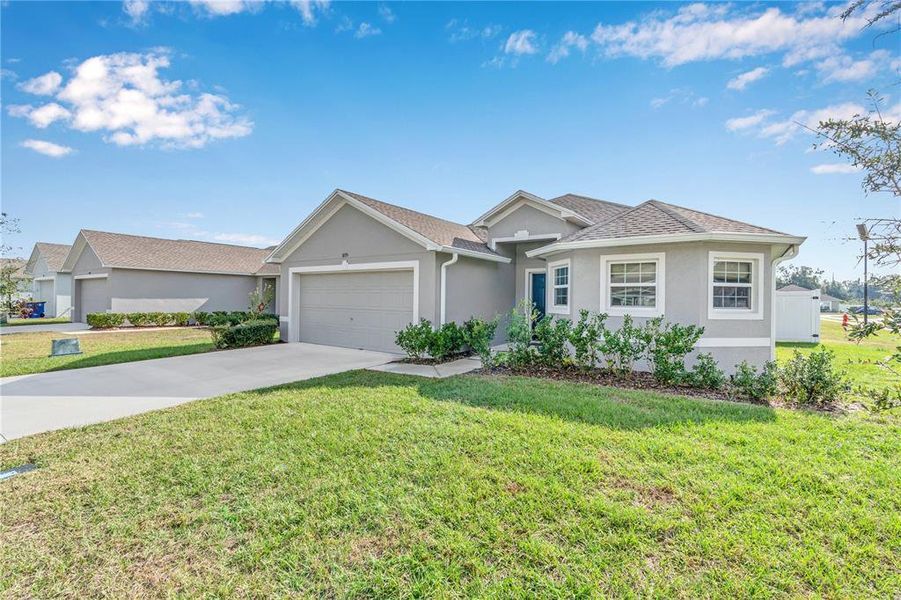 Front exterior of a new home in Thompson Preserve, Bartow, FL, highlighting curb appeal (Image 2). Front exterior of a new home in Thompson Preserve, Bartow, FL, highlighting curb appeal (Image 2).
