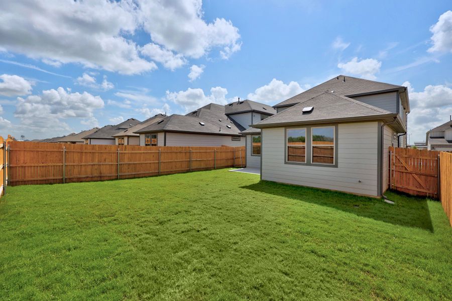 Exterior details and patio area of a home in Trinity Ranch, Elgin (Image 25).