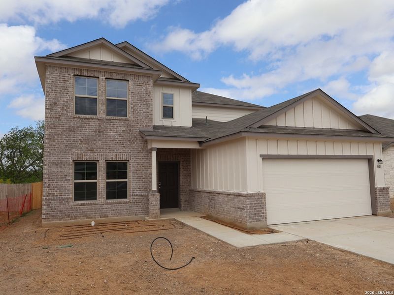 Front exterior of a new home in Cinco Lakes, San Antonio, TX, highlighting curb appeal (Image 18). Front exterior of a new home in Cinco Lakes, San Antonio, TX, highlighting curb appeal (Image 18).