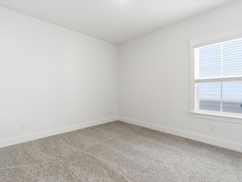 Spacious, unfurnished interior of a new home in The Coves at Lakes of Cane Bay, Summerville (Image 38).