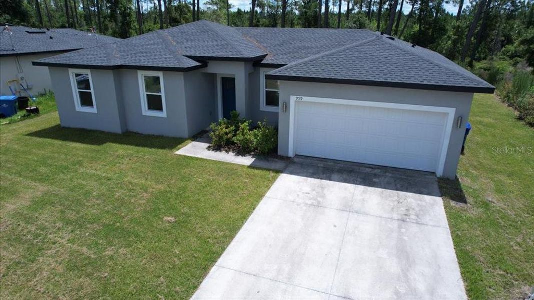 Front exterior of a new home in , Deland, FL, highlighting curb appeal (Image 2). Front exterior of a new home in , Deland, FL, highlighting curb appeal (Image 2).