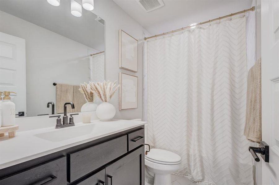 Upper Level Full bath featuring vanity and a shower with shower curtain