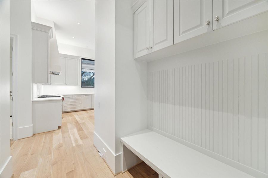 [Mud Room]The mud room includes a drop zone with storage cabinets and entry to the oversized two-car garage.