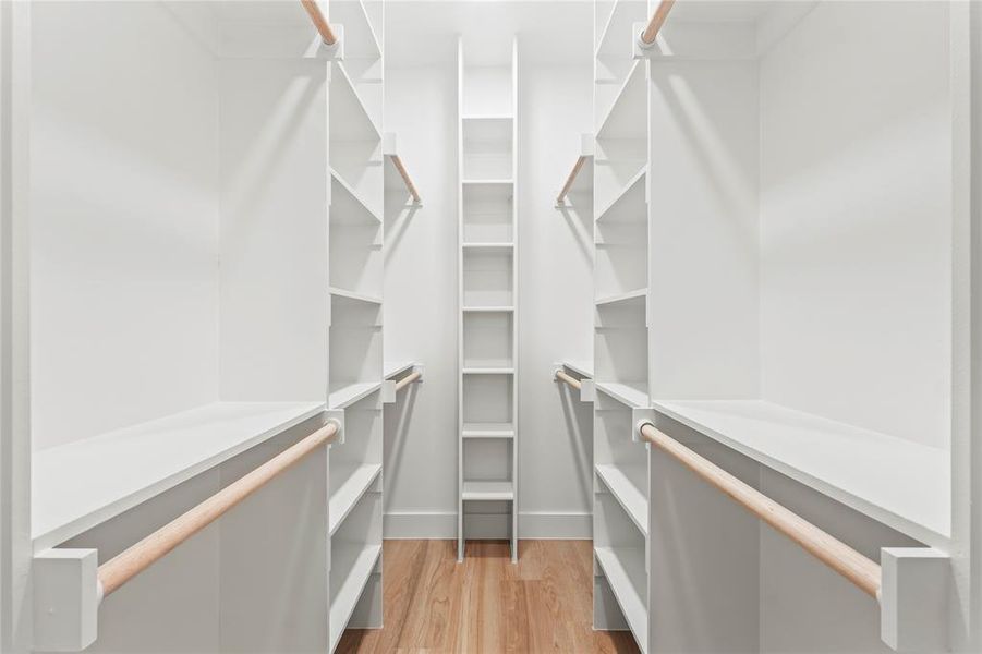 Spacious closet with light wood-type flooring