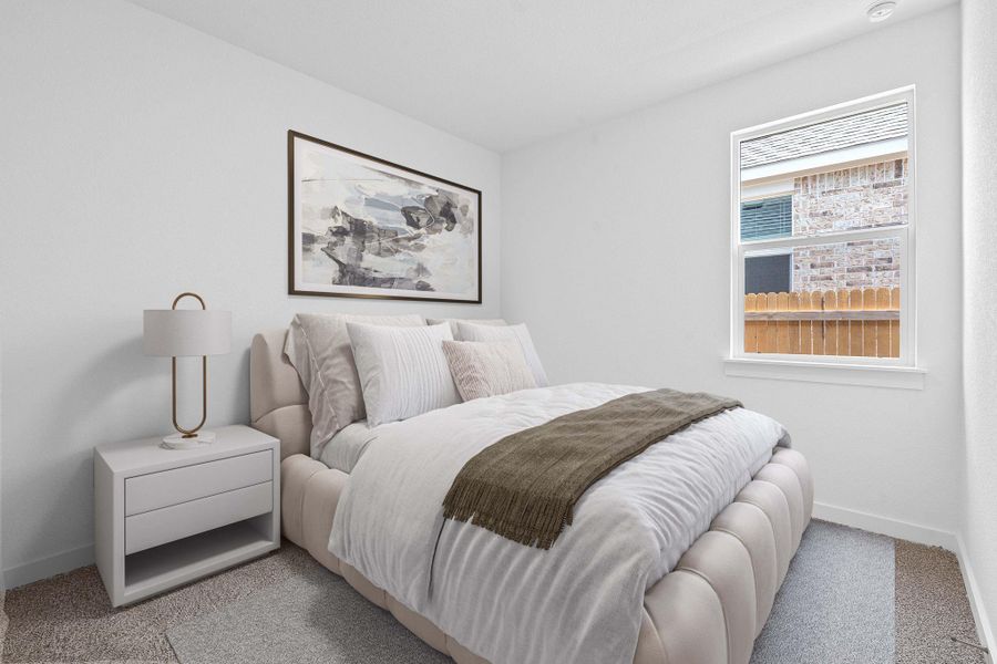 Carpeted bedroom with baseboards Carpeted bedroom with baseboards