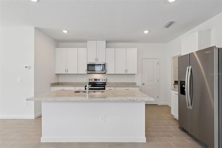 Furnished interior view inside a new home in Flagler Village - Classic Series, Palm Coast (Image 7).