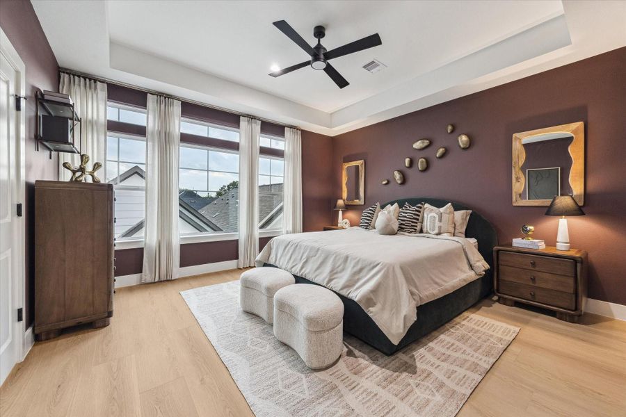 Primary bedroom retreat with serene views and modern finishes Primary bedroom retreat with serene views and modern finishes