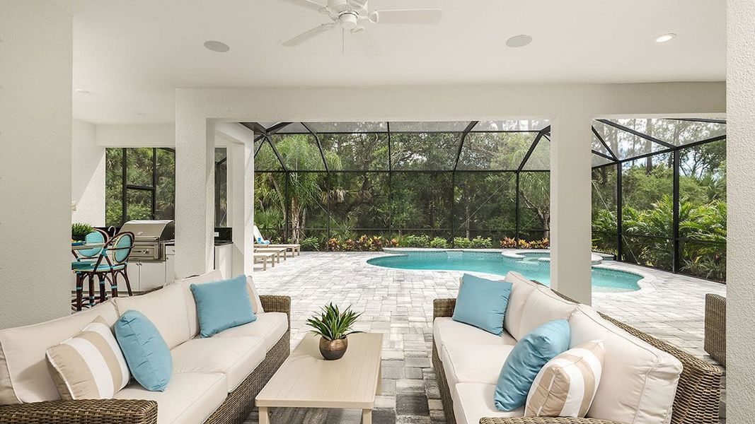 Exterior details and patio area of a home in SkySail Real Estate and Homes for Sale in Naples, FL - Neal Communities, Naples (Image 2).