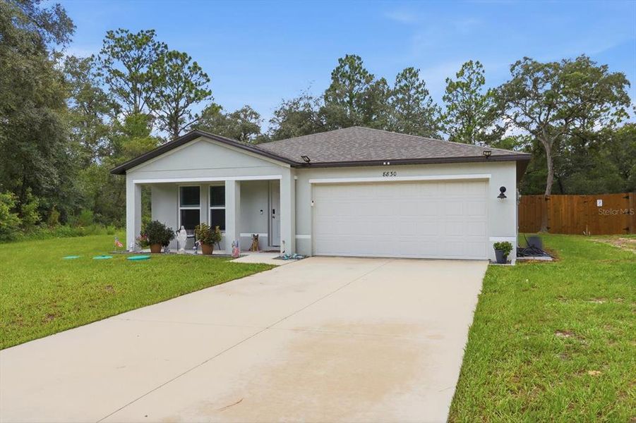 Front exterior of a new home in Citrus Springs, Citrus Springs, FL, highlighting curb appeal (Image 1). Front exterior of a new home in Citrus Springs, Citrus Springs, FL, highlighting curb appeal (Image 1).