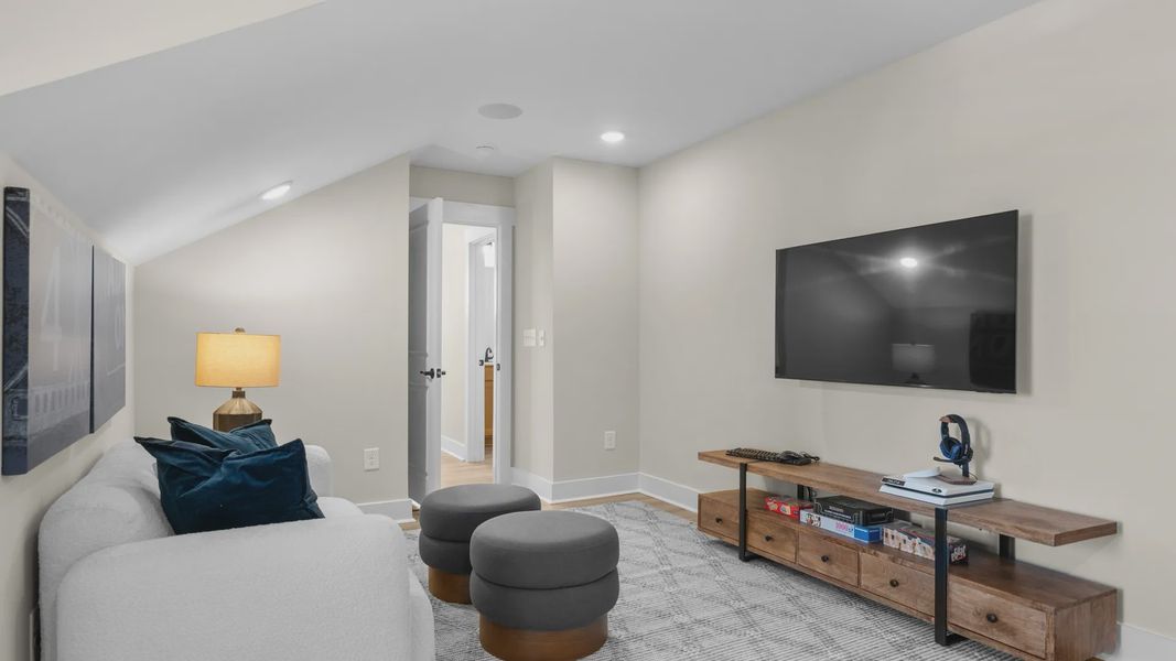 Second-floor bonus room in the Summit home plan with versatile space for entertaining or relaxing.