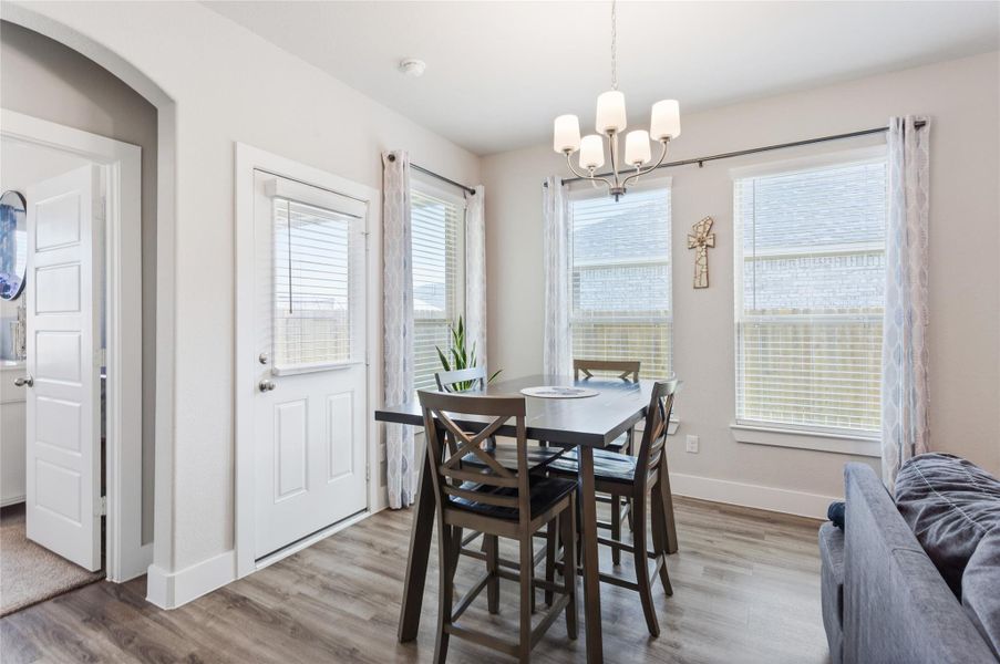 Bright and inviting breakfast nook with ample natural light and elegant finishes, perfect for starting your day. Bright and inviting breakfast nook with ample natural light and elegant finishes, perfect for starting your day.