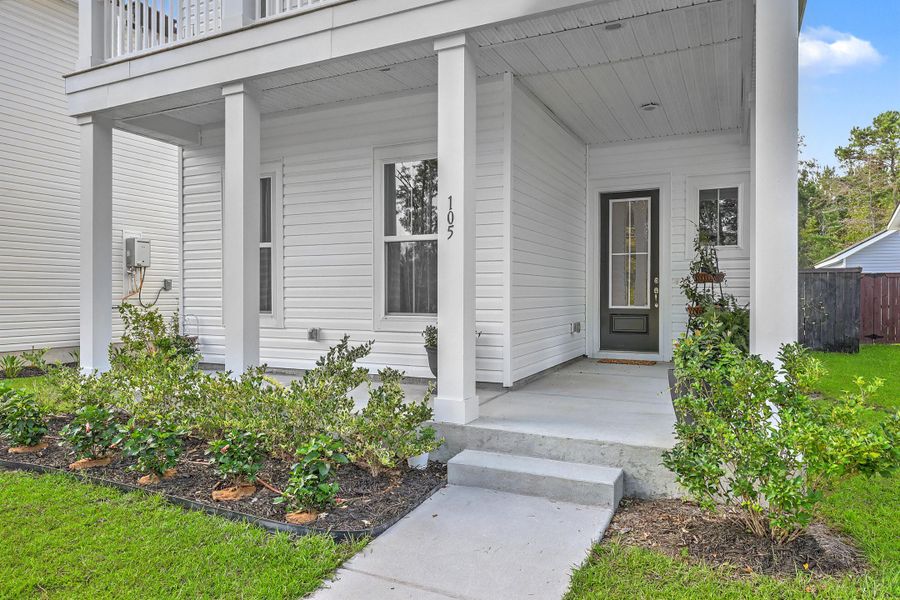 Exterior details and patio area of a home in Limehouse Village: Row Collection, Summerville (Image 4).