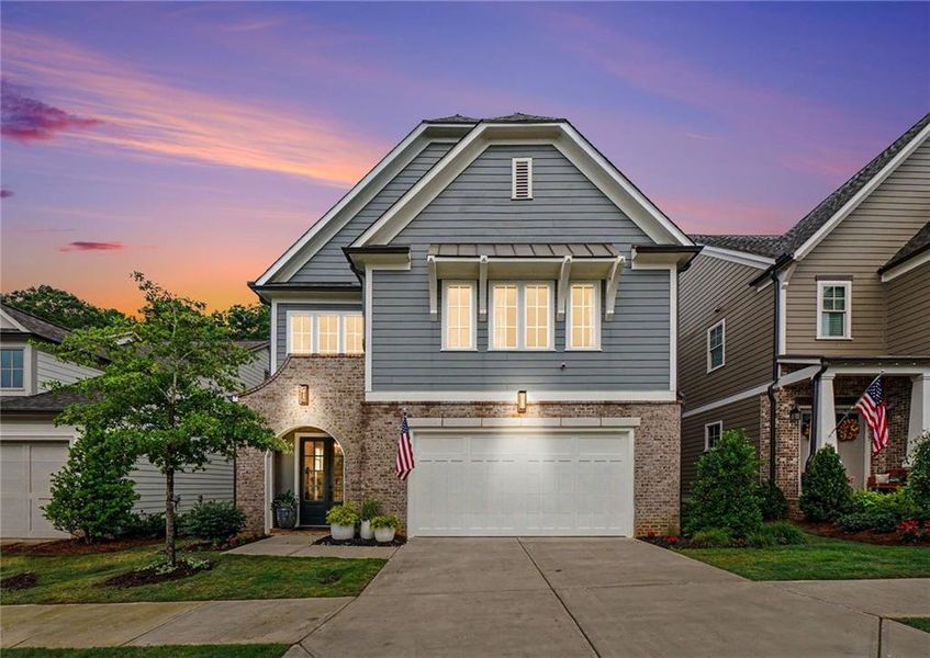 Front exterior of a new home in Lakeside at River Green, Canton, GA, highlighting curb appeal (Image 23). Front exterior of a new home in Lakeside at River Green, Canton, GA, highlighting curb appeal (Image 23).