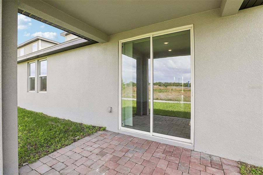 Exterior details and patio area of a home in The Meadow at Crossprairie, St. Cloud (Image 4).