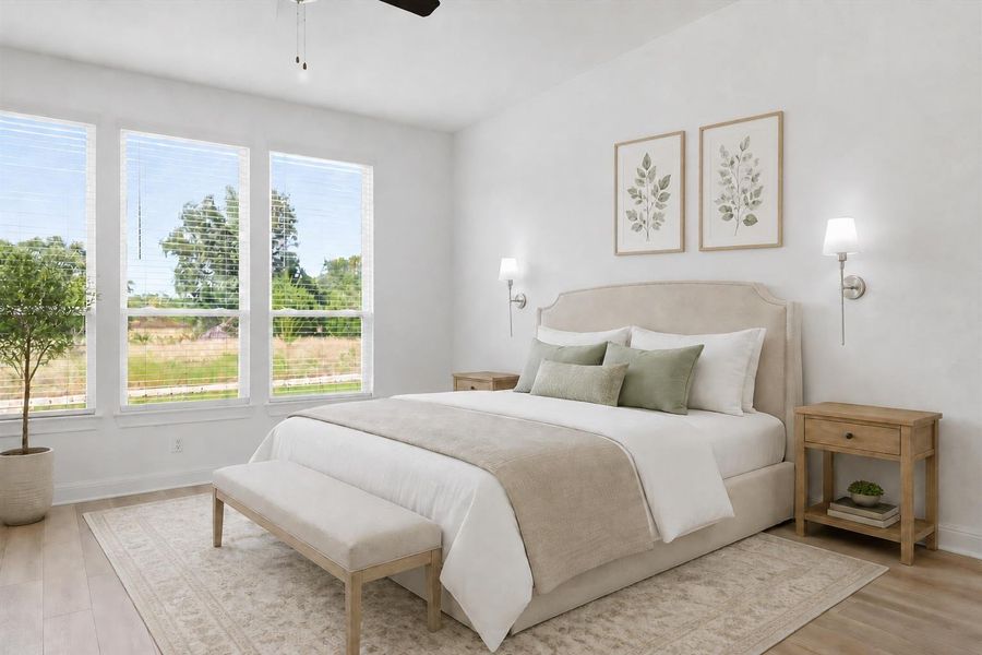 Virtually staged. Natural light floods this inviting bedroom, featuring light hardwood floors and expansive views of the outdoors. Virtually staged. Natural light floods this inviting bedroom, featuring light hardwood floors and expansive views of the outdoors.