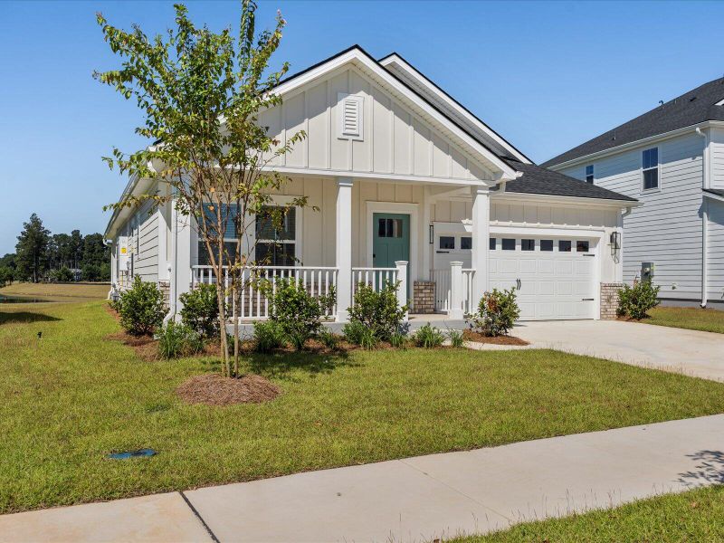 Front exterior of a new home in The Coves at Lakes of Cane Bay, Summerville, SC, highlighting curb appeal (Image 27). Front exterior of a new home in The Coves at Lakes of Cane Bay, Summerville, SC, highlighting curb appeal (Image 27).