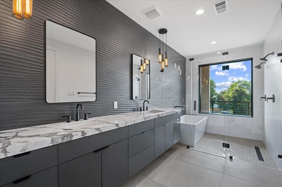Primary bathroom featuring double vanity, a stall double shower with a soaking tub, light tile patterned floors, and recessed lighting Primary bathroom featuring double vanity, a stall double shower with a soaking tub, light tile patterned floors, and recessed lighting