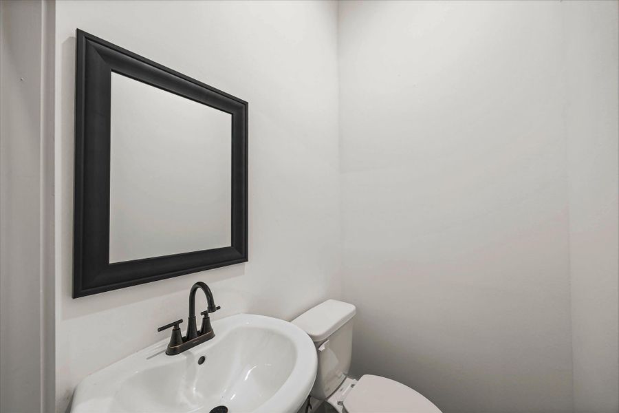 Half-bath located in garage.